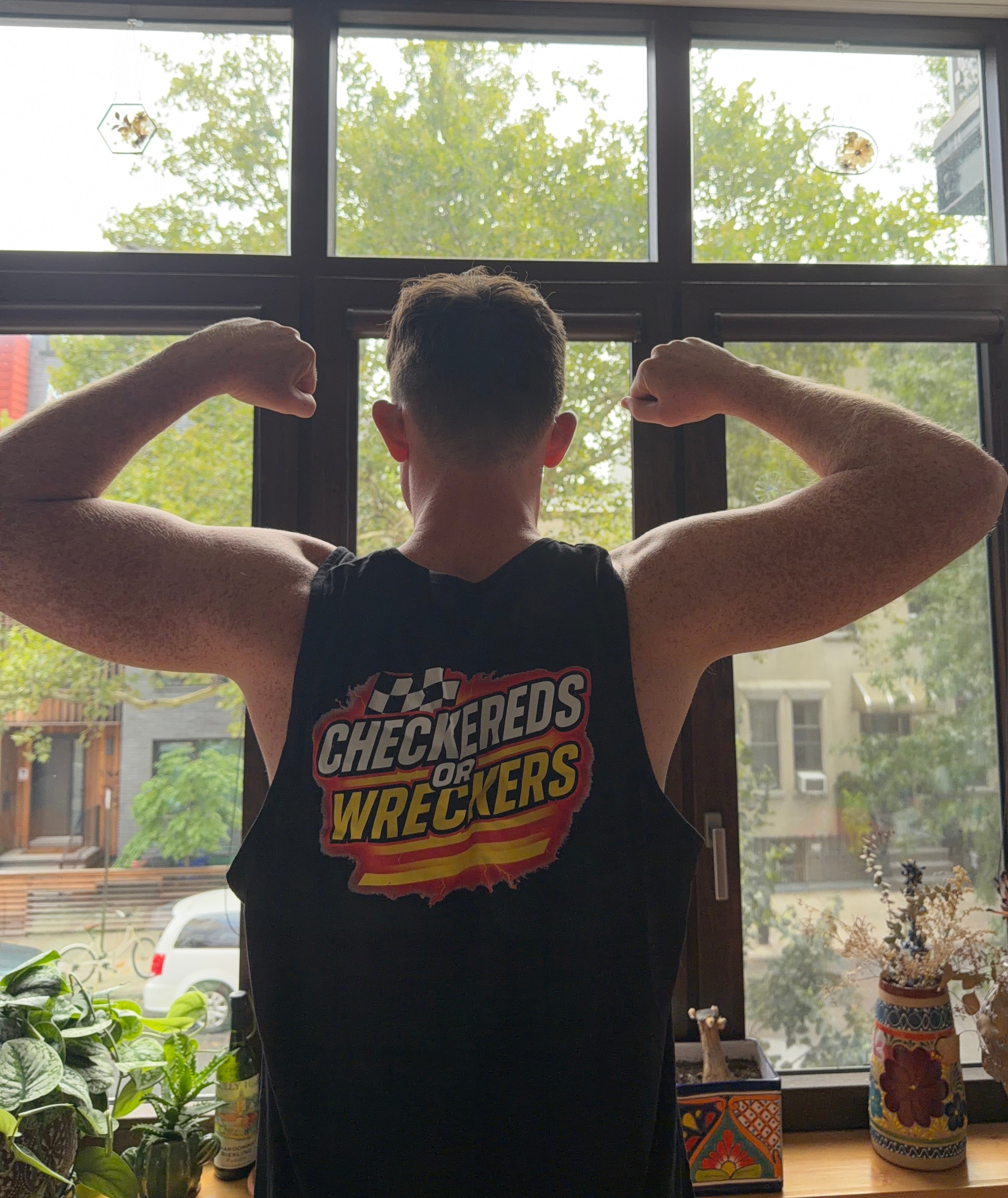 Checkereds or Wreckers black tank top back flex pose
