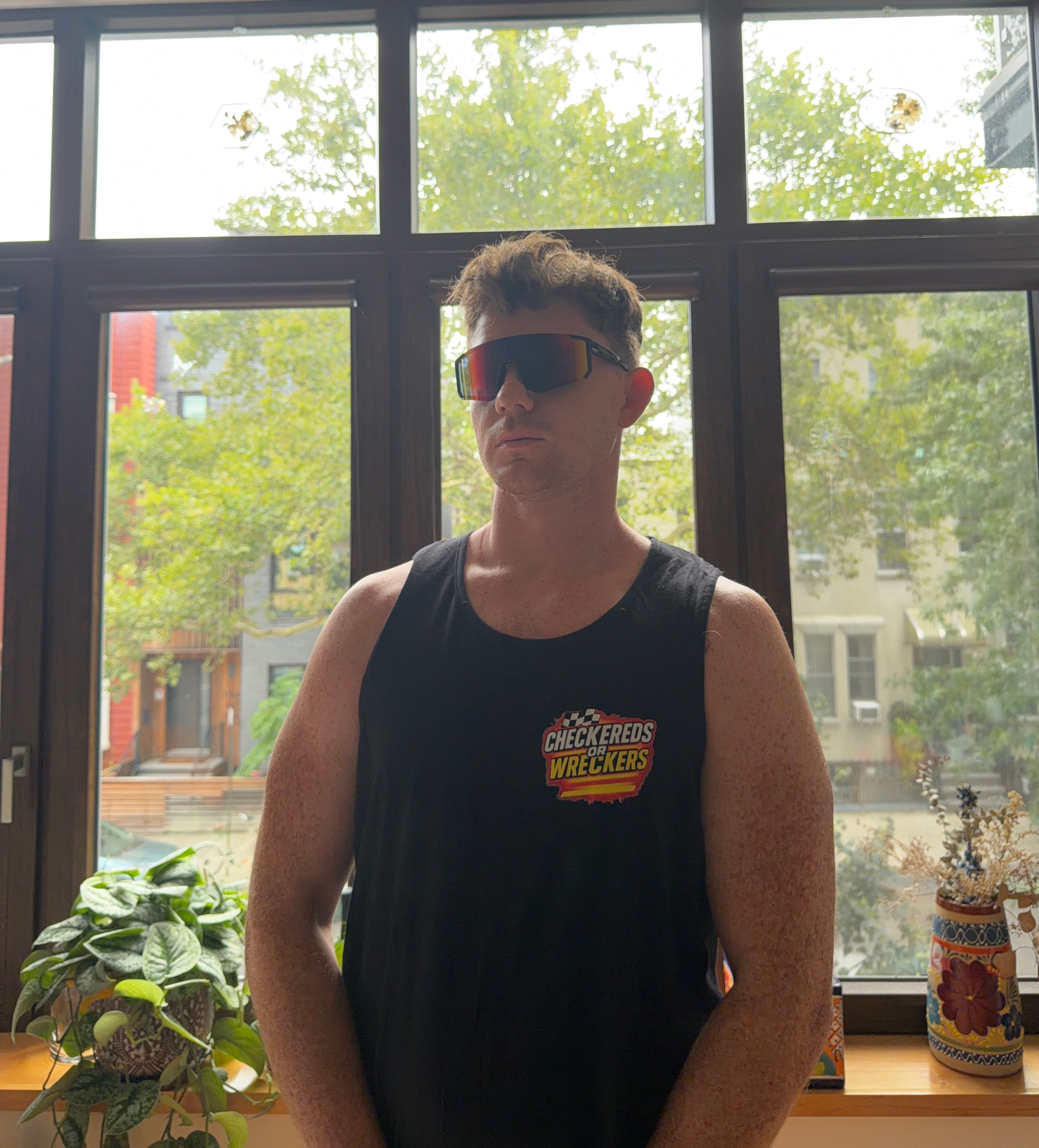 Checkereds or Wreckers black tank top front chest logo serious pose