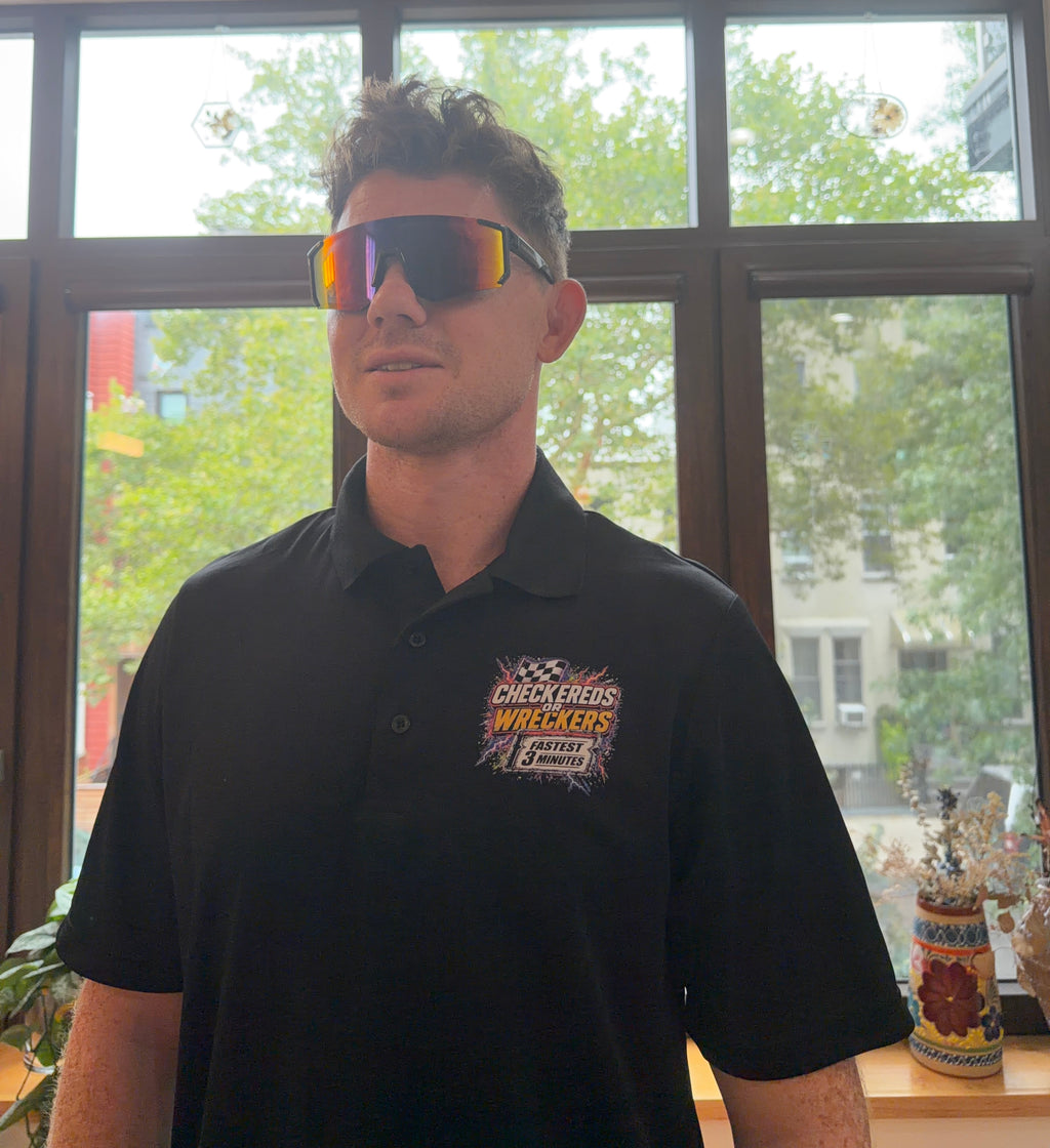 Checkereds or Wreckers black polo full front view with sunglasses